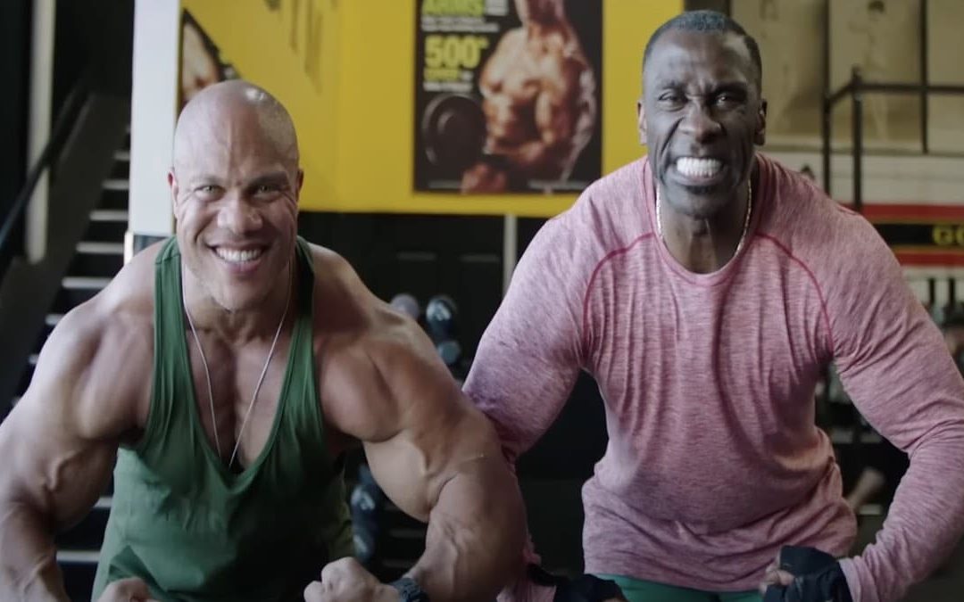 phil-heath-guides-nfl-hall-of-famer-shannon-sharpe-through-a-bodybuilding-training-session-–-breaking-muscle