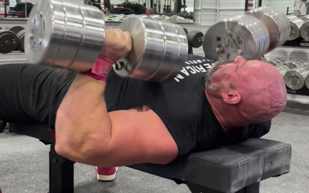 brian-shaw-benches-91-kilogram-(200-pound)-dumbbells-for-5-fast-reps-before-his-final-strongman-contest-–-breaking-muscle